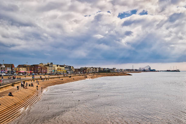istock Scenic Beach View with People and Amusement Rides in Blackpool, UK 2173570406