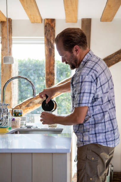 istock Man pouring a cup of coffee 2173578492