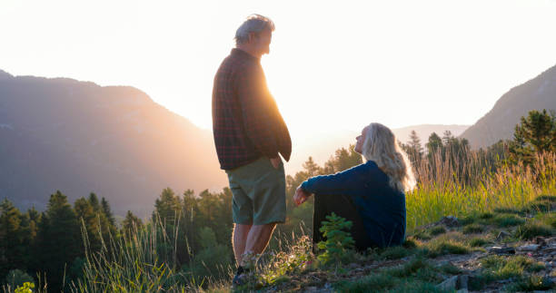 istock Mature couple watch sunset over mountains 2173587689