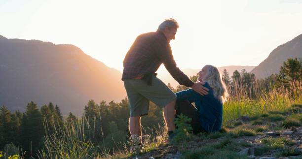 istock Mature couple watch sunset over mountains 2173587749