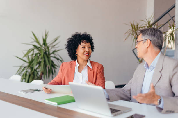 istock Professional colleagues discussing business at a workspace area 2173588030