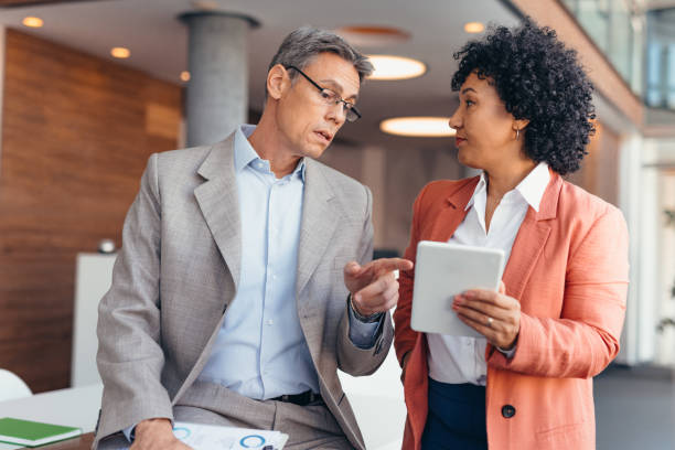 istock Professional colleagues discussing business at a workspace area 2173588079