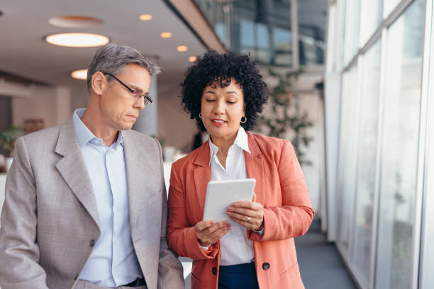 istock Professional colleagues discussing business at a workspace area 2173588080