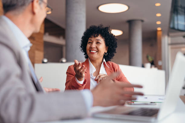 istock Two professionals engaged in a lively discussion at a meeting. 2173588145