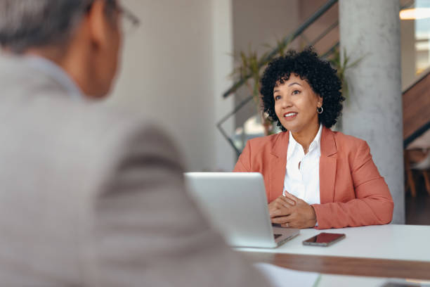 istock Two professionals engaged in a lively discussion at a meeting. 2173588164