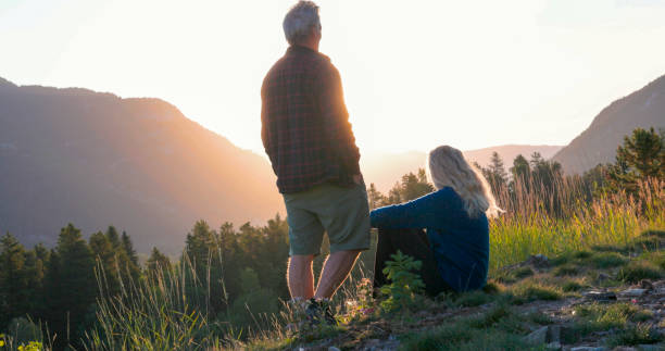 istock Mature couple watch sunset over mountains 2173588273