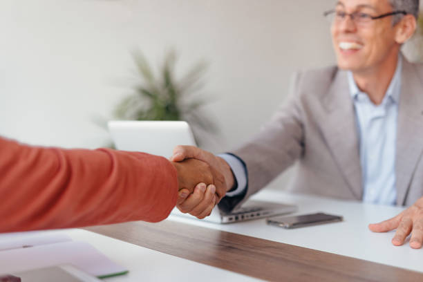 istock Businessmen handshake in the office 2173588287