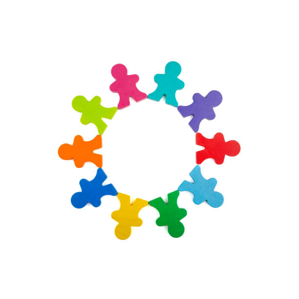Circle of wooden figures in different colors symbolizing the concepts of diversity, unity, teamwork, cooperation, community