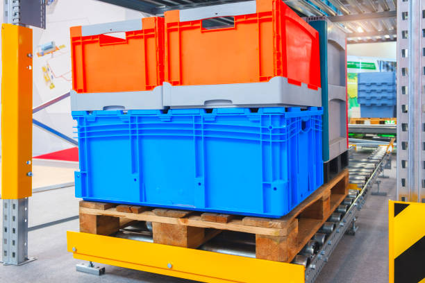 istock Plastic boxes on a wooden pallet automated conveyor belt in a modern warehouse 2173604376