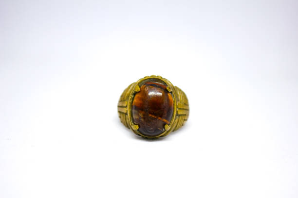 istock Brown agate ring (stone ring akik) with metal sprinkles isolated on white background 2173610895