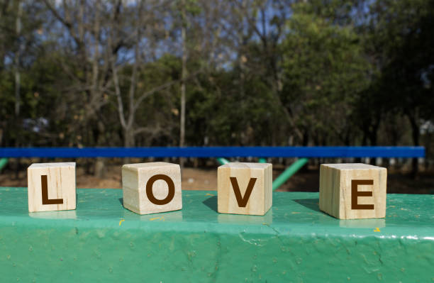 Wooden cubes that say the word love At the park