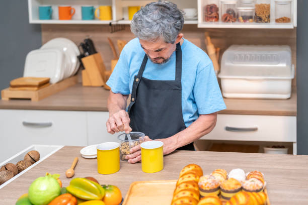 istock old man preparing breakfast in the kitchen,elderly lifestyle,domestic life,cooking 2173632550