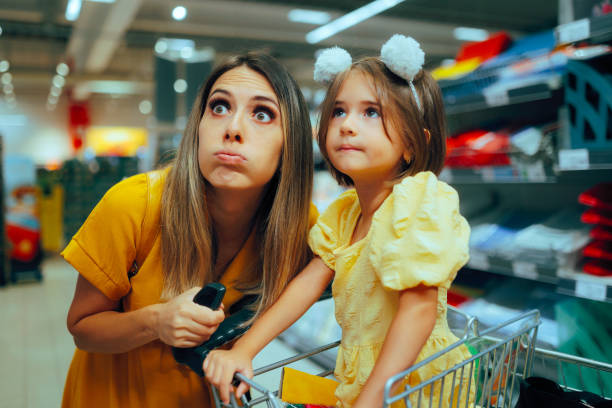 istock Daughter and Mom Shopping Together Looking Surprised 2173634495