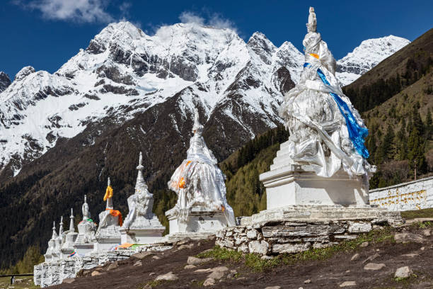 istock White stupas with snowy mountains near Mount Siguniang 2173638314