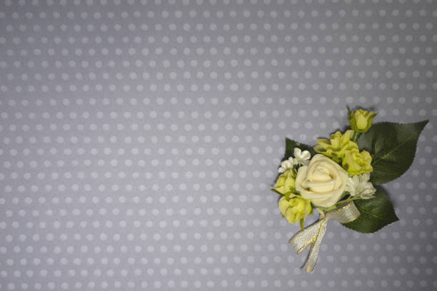 Simple background with white rose boutonniere