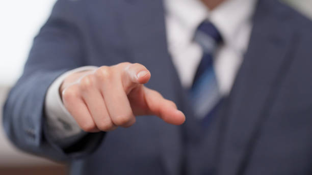The hand of a businessman pointing stock photo
