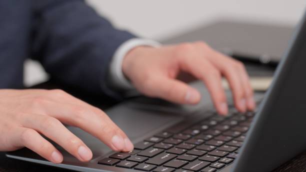 istock Hands of a businessman pressing arrow keys 2173648628