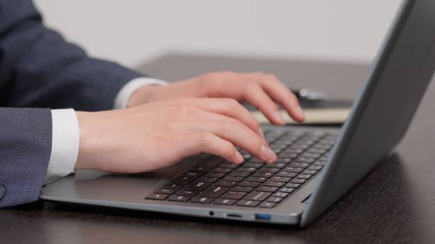 istock Hands of a businessman typing 2173648630