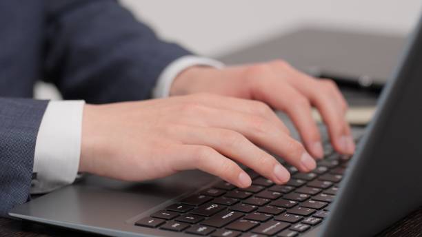 istock Hands of a businessman typing 2173648633