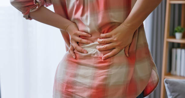 istock woman has lower back pain 2173650171