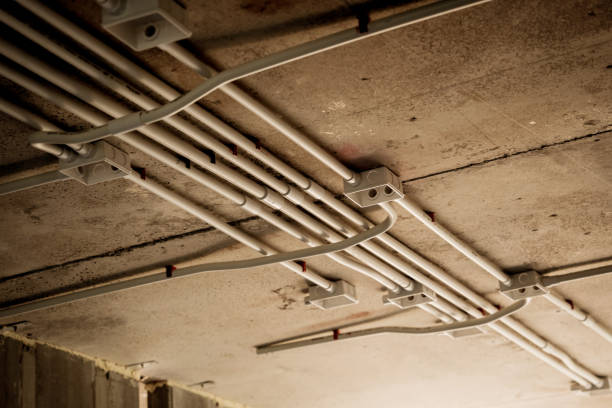 istock The electrical wiring at the construction site is completed and suspended from the ceiling 2173652386