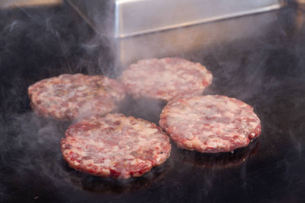istock Grilling burgers 2173654904