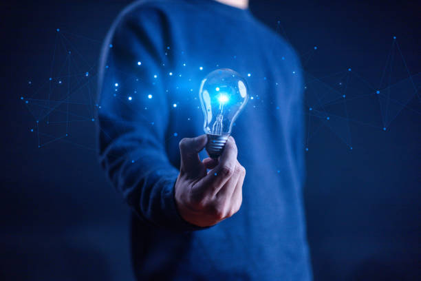 istock Innovation and inspiration concept. Businessman holding creative light bulb with industry and marketing development network icons. Strategic planning. Modern business and inspiration Idea innovation 2173664992