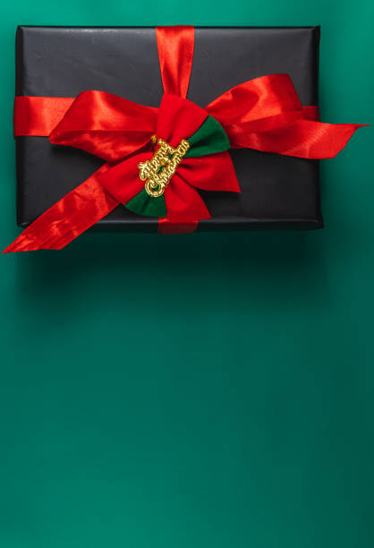 istock Banner with gift box with red bow and Merry Christmas, on green background 2173667093