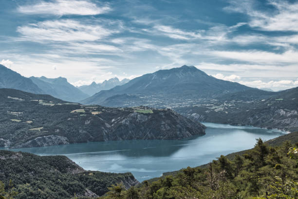 Chorges, France - July 2, 2024. Panoramic view of Lake Serre-Ponçon from a peak in the French Alps.