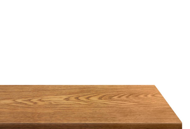 Side view of empty wooden table isolated on white background.