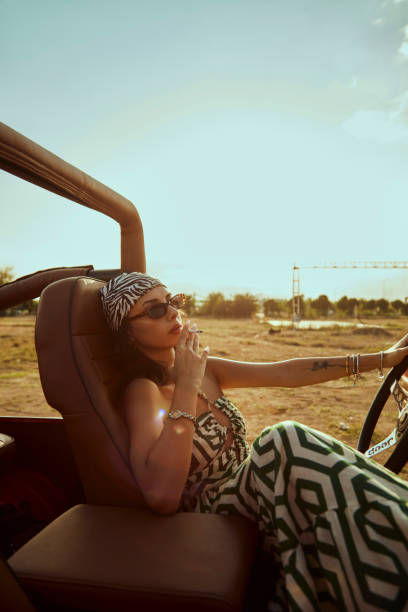 istock The beautiful woman in the jeep. 2173676810
