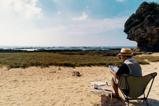istock Senior man watercolor painting on a beach 2173679443