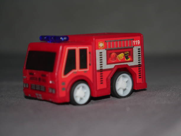 istock Ready to rescue: An isolated toy firefighter car waiting for action 2173681365