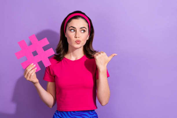 istock Portrait of doubtful lady pouted lips look indicate finger empty space hesitate isolated on purple color background 2173682277