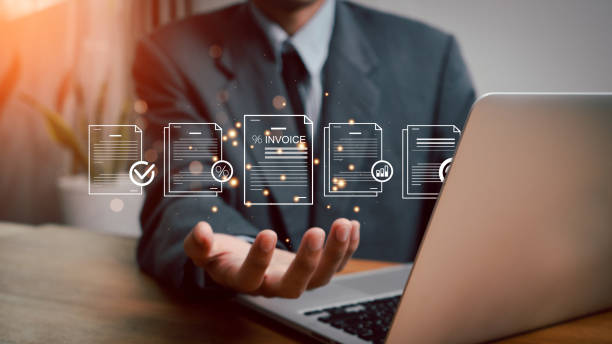 istock E-invoice and online digital statements concept. Businessman using computer laptop with invoice icons on virtual screen. 2173683170