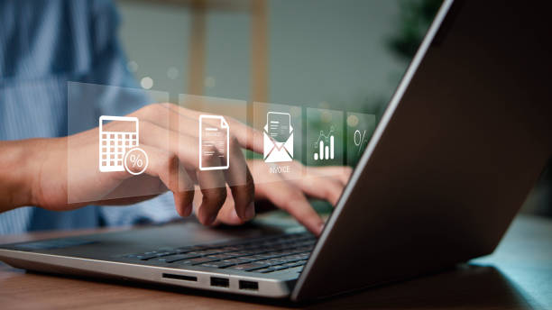 istock E-invoice and online digital statements concept. Businessman using computer laptop with invoice icons on virtual screen. 2173683206