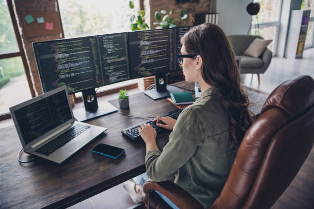 istock Photo of intelligent adorable lady working startup project hacking site write new app program site  indoor room workstation 2173683314