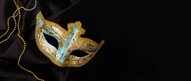 istock Christmas carnival mask on the on the black textile background. Copy space. Top view. 2173683753
