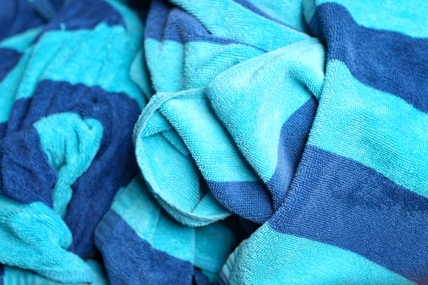 Towel texture close up. Terry cloth bath or beach towel. Soft fluffy textile. Top view. towel macro material.