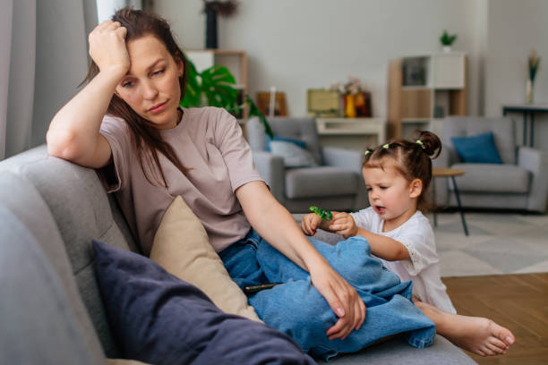 istock Tired single mother suffering from depression 2173692248