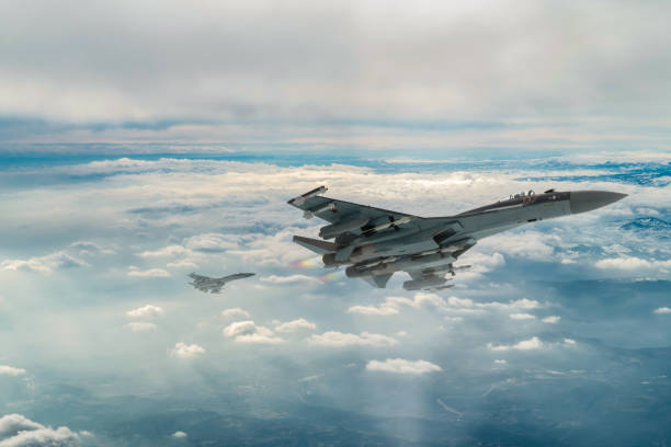 istock Jet fighters flying over snowcapped mountains. 2173694203
