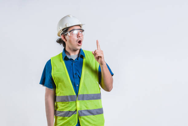 istock Amazed engineer pointing up isolated. Surprised young architect pointing up. Engineer with astonished face pointing at blank space 2173705082