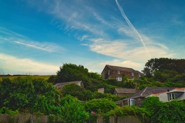 roof seen from low angle with blue sky and stratocumulus clouds
