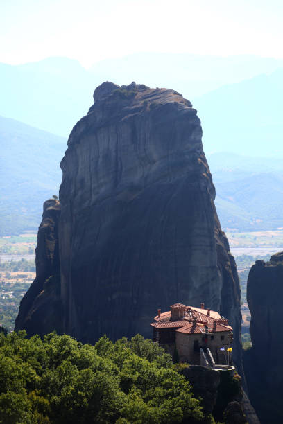 meteora landscape with rocky mountains and sanctuary in greece