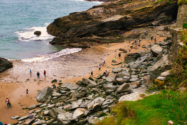 istock Scenic Rocky Beach with People Exploring in Tintagel, Cornwall, UK 2173706836