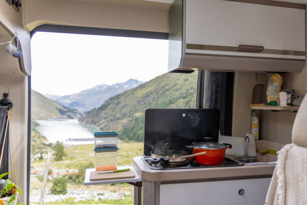 istock Campervan Kitchen with Scenic Mountain and Lake View 2173706913