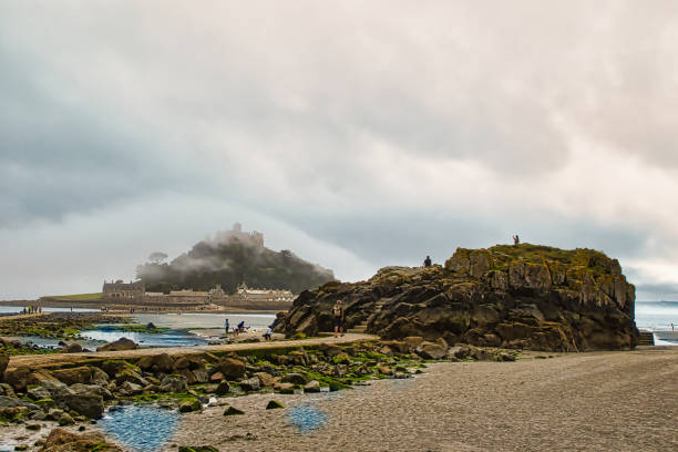 The incoming tide covers the causeway that leads to the Cornish landmark that is St Michael's Mount.