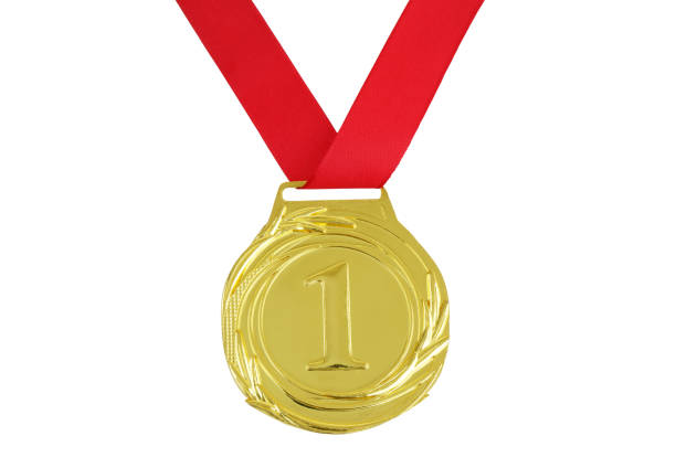 Gold medal with red ribbon isolated on white background.