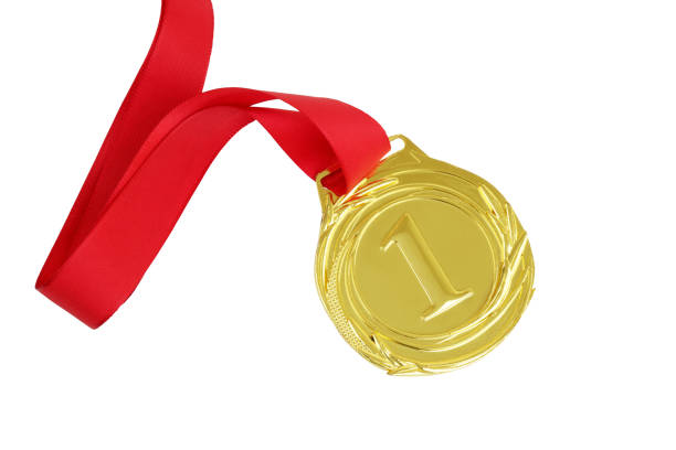 Gold medal with red ribbon isolated on white background.