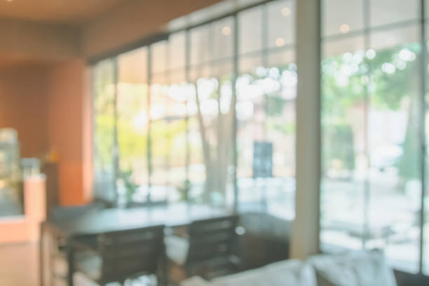 istock Abstract blur interior coffee shop or cafe for background. Blur restaurant interior banner. Hospital and clinic blurry with bokeh. Blurred windows green on garden outdoor and view of light living room 2173712535